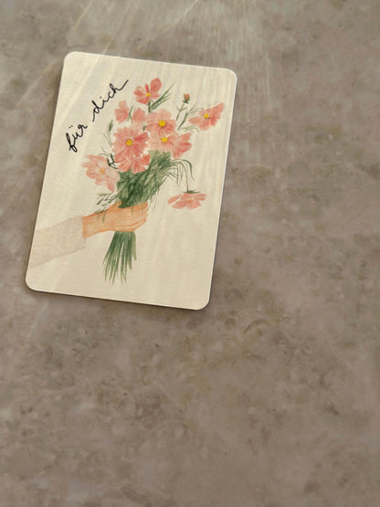 Karte Hand hält Blumen