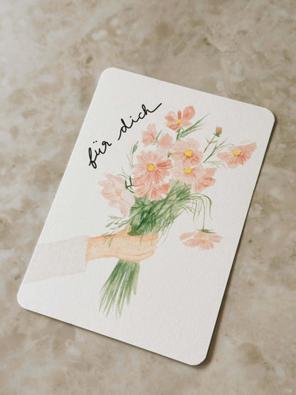 Karte Hand hält Blumen