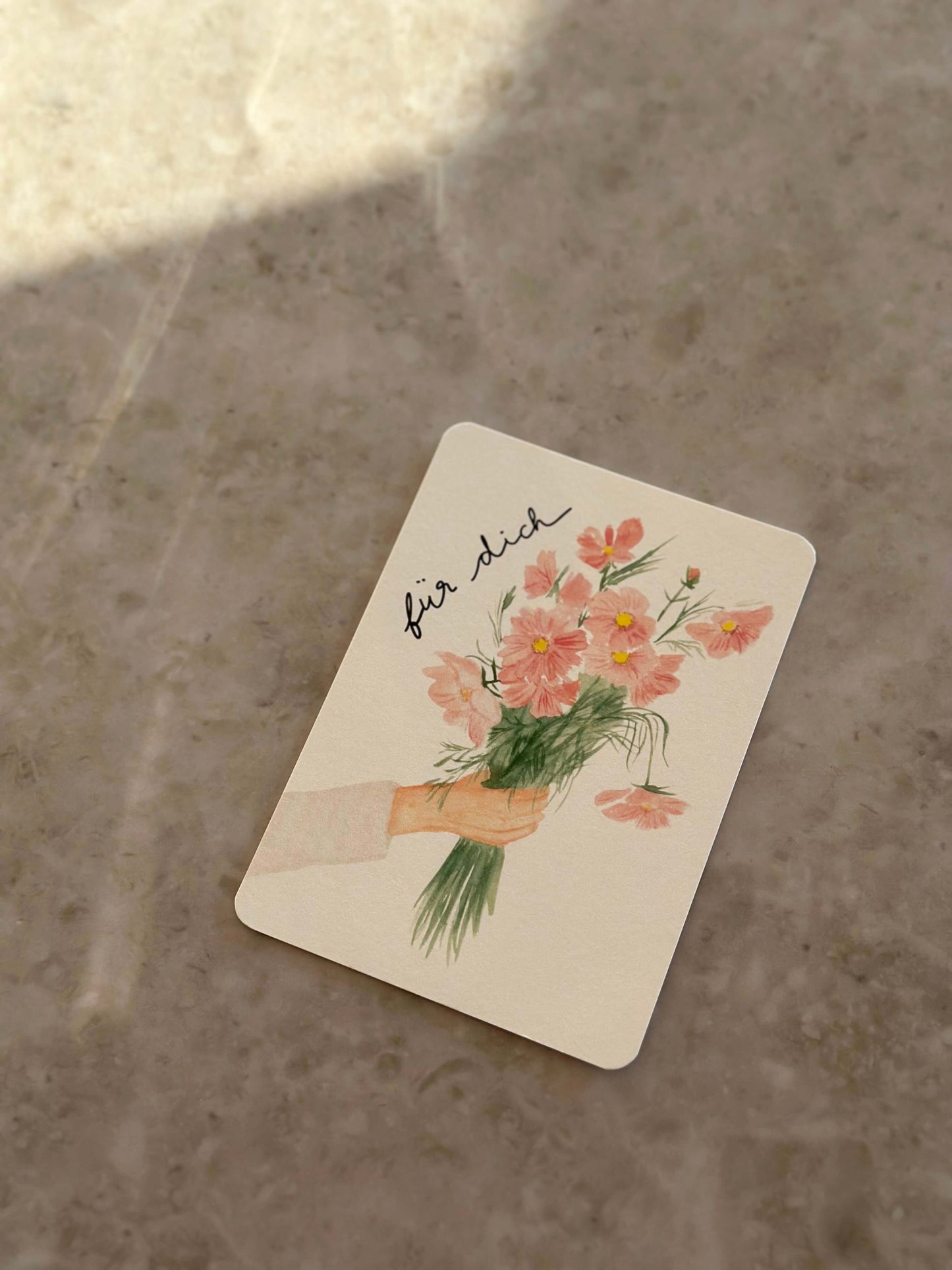 Karte Hand hält Blumen